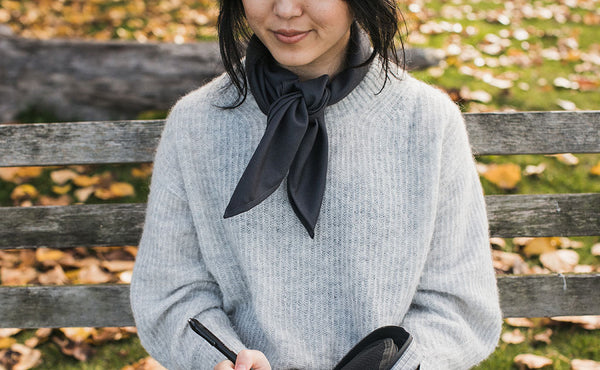 A person wearing the Shepherd's Wool Utility Cloth as a kerchief.